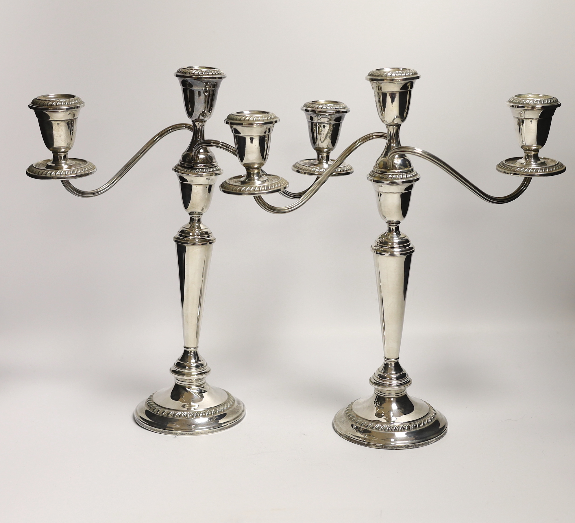 A pair of 20th century Alvin sterling three light, two branch candelabra, height 32.1cm, weighted